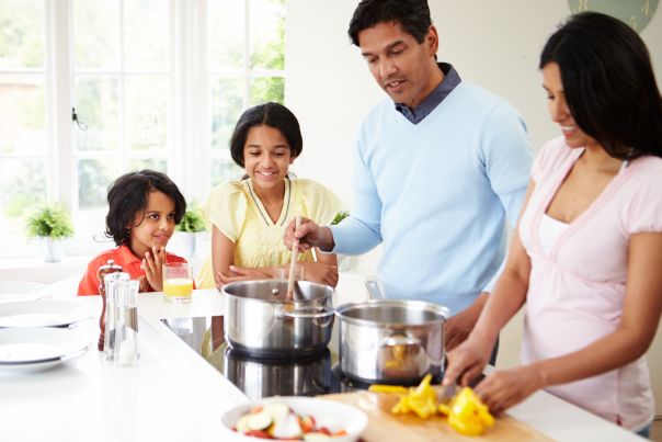 Family using gas induction cooktop